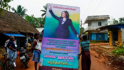 Residents prepare to put up a hoarding with a photo of US Vice President-elect Kamala Harris, at her ancestral village of Thulasendrapuram, in the southern Indian state of Tamil Nadu. AFP