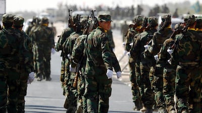 Members of the Popular Mobilisation militias supporting Iraqi government forces march on September 24, 2016 as part of a parade from Karbala to Najaf to review the military equipment to be used in the operation to retake Mosul from ISIL. Haidar Hamdani / AFP