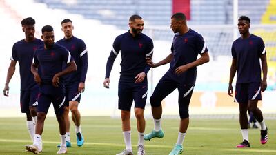 Kylian Mbappe, and Karim Benzema with teammates during training. Reuters