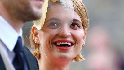 Pixie Geldof and George Barnett arrive to attend the wedding. AFP