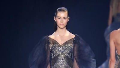 Resembling something an ethereal mermaid would wear, this dress in shimmering water tones is framed by a cascading ombré cape. Antonio de Moraes Barros Filho / FilmMagic / Getty Images