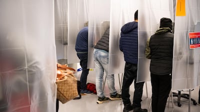 Residents of Cuyahoga county fill out paper ballots for early, in person voting at the board of elections office in downtown Cleveland, Ohio. AFP