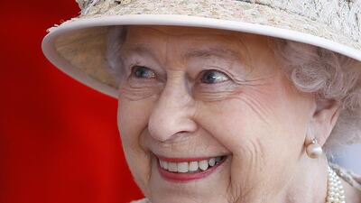 Britain’s Queen Elizabeth II smiles as she awaits the arrival of the President of the United Arab Emirates Sheik Khalifa bin Zayed Al Nahyan in Windsor in England on April 30, 2013. Kirsty Wigglesworth / AP photo
