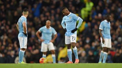 Manchester City's Sergio Aguero (L) and Kelechi Iheanacho (C) react after Tottenham Hotspur's Christian Eriksen scores the 2-1 goal during the English Premier League soccer match between Manchester City and Tottenham Hotspur at the Etihad Stadium, Manchester, Britain, 14 February 2016. EPA/PETER POWELL