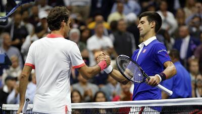 Novak Djokovic, right, has been tough to break down for Roger Federer. Julio Cortez / AP Photo