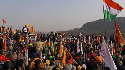 Protesting farmers are stopped at a barricade during a tractor rally near the Singhu border crossing in Delhi, India. Bloomberg