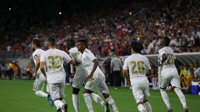 Real Madrid forward Rodrygo, centre, celebrates his consolation goal. Reuters