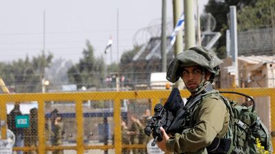 An Israeli soldier stands near the Quneitra crossing in the Golan Heights on the border line between Israel and Syria, October 15, 2018. Reuters