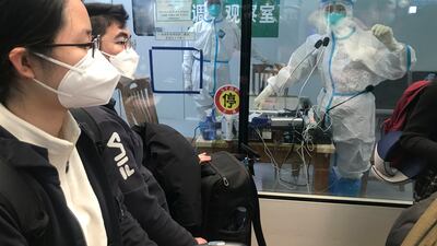 China will drop Covid-19 quarantine requirements for passengers arriving from abroad starting January 8. AP