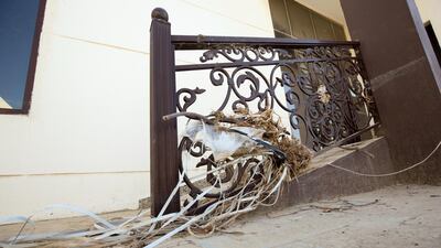 A damaged house in Al Raheeb town