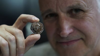 Martin Jennings with one of the first coins produced.