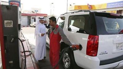A station attendant fills up a car at petrol station in Jeddah. With inflation rising across the Gulf, Saudi Arabia's perennial problem of unequal distribution of wealth has never been so obvious.