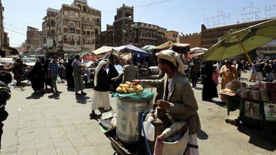 Yemenis walk through a market ahead of Ramadan in Sana'a, Yemen. EPA