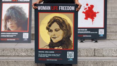 People take part in a protest at Trafalgar Square after marching through London in the lead-up to the anniversary of the death of Mahsa Amini. Getty Images
