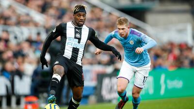 Newcastle's Allan Saint-Maximin (L) and Manchester City's Kevin De Bruyne (R) in action. AFP