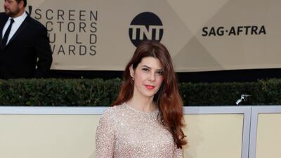 Marisa Tomei wore a pared-down but still very glam Laura Basci dress in a gorgeous rose-gold hue. Mike Nelson / EPA