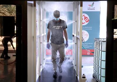 A commuter enters the new sterilisation area at the entrance of the Abu Dhabi Central Bus Terminal. The National