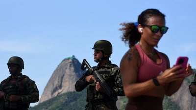 Members of the military stand guard near the Botafogo Beach. Reuters
