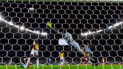 Uruguay's Luis Suarez (R) celebrates after an own goal by Ecuador's Arturo Mina (covered) during their Copa America football tournament group match at the Mineirao Stadium in Belo Horizonte, Brazil. AFP