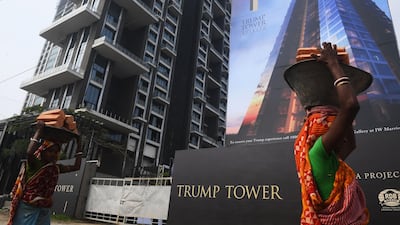 Indian labourers work on the road leading to the under-construction Trump Tower in Kolkata. Dibyangshu Sarkar / AFP