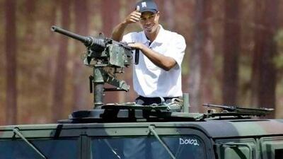 A 2004 file photo of Tiger Woods at Fort Bragg, North Carolina. During a three-day stay at the military base, he fired weapons, awoke early for four-mile runs and jumped from planes using parachutes.