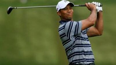 Tiger Woods plays his tee shot on the fourth hole at Bethpage Black as he and the rest of the field struggled to cope with the elements.