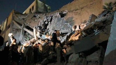 Libyan soldiers survey the damage to an administrative building hit by a missile in the heart of Muammar Qaddhafi's Bab Al Azizia compound in Tripoli.