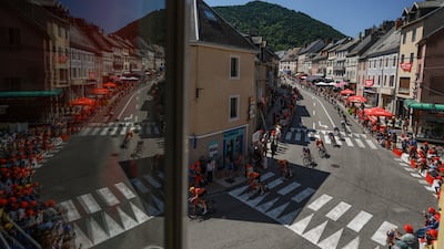 Cyclists race through Voiron, south-eastern France, during stage 18 of the Tour de France. Reuters