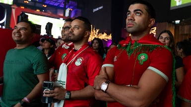 Morocco fans in JBR, Dubai, watch as their team take on France in the World Cup. Ruel Pableo for The National