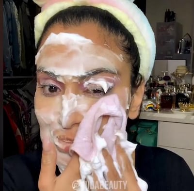 Huda Kattan uses shaving foam all over her face to remove make-up. Facebook / Huda Beauty