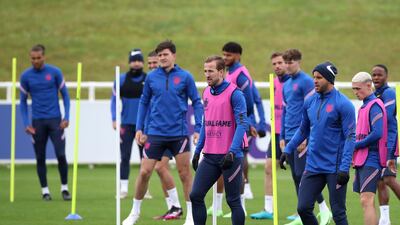 England captain Harry Kane, centre in pink bib, during training. PA