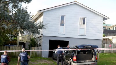 New Zealand Police guard a house on Rena Place after arresting two men. Getty Images