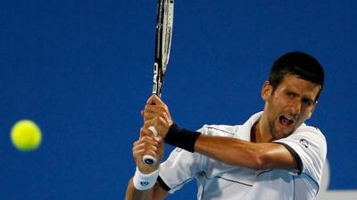 Novak Djokovic eased past David Ferrer in the final in Abu Dhabi.