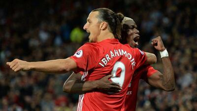 Zlatan Ibrahimovic celebrates with Paul Pogba after putting Manchester United 2-0 ahead. Oli Scarff / AFP