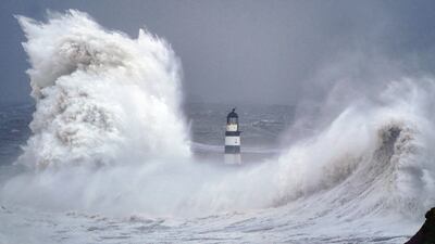 Huge waves crashed against the lighthouse in Seaham Harbour, in County Durham, on Monday, during the tail end of Storm Arwen which produced gusts of almost 100 miles per hour. PA