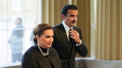 Qatari Emir Sheikh Tamim walks into the reception hosted by Britain's King Charles. AP