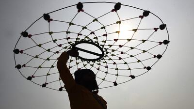 A member of the youth wing of the Indian Armed Forces, the National Cadet Corps, performs during a commemoration of the 125th anniversary of Saragarhi Battle, at the Golden Temple in Amritsar. AFP