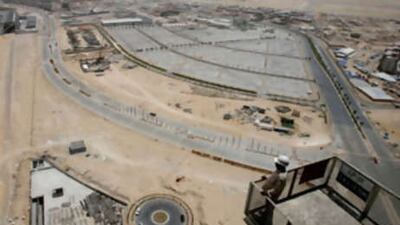 A builder looks out across some of the 900 million square metres of Dubailand.