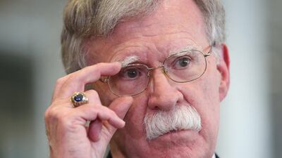 Mr Trump says he fired national security adviser John Bolton, says they 'disagreed strongly' on many issues. EPA