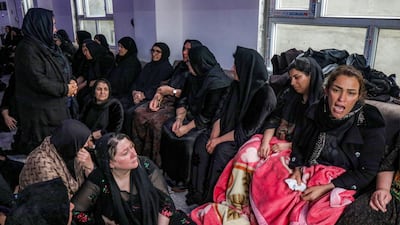 Mourners at the funeral of Iraqi Kurdish Peshmerga fighters killed in a strike, in Soran, near the Iranian border. AFP