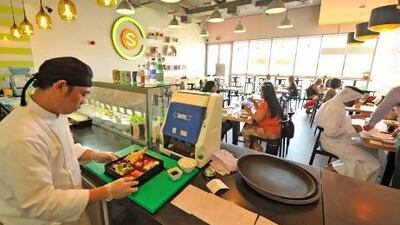 The atmosphere at Chez Sushi at Al Wasl Square in Jumeirah is airy and vibrant. Charles Crowell for The National