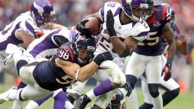 Adrian Peterson, with the ball, has amassed the eighth most rushing yards ever. Patric Schneider / AP Photo