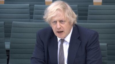 A video grab from footage broadcast by the UK Parliament's Parliamentary Recording Unit (PRU) shows Britain's Prime Minister Boris Johnson giving evidence to the House of Commons Liaison Committee at the Houses of Parliament in London on March 24, 2021. - RESTRICTED TO EDITORIAL USE - MANDATORY CREDIT " AFP PHOTO / PRU " - NO USE FOR ENTERTAINMENT, SATIRICAL, MARKETING OR ADVERTISING CAMPAIGNS
/ AFP / PRU / - / RESTRICTED TO EDITORIAL USE - MANDATORY CREDIT " AFP PHOTO / PRU " - NO USE FOR ENTERTAINMENT, SATIRICAL, MARKETING OR ADVERTISING CAMPAIGNS