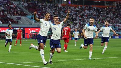 Jude Bellingham celebrates scoring England's first goal alongside Mason Mount. Reuters