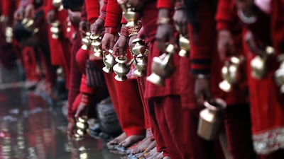 Nepalese Hindu women fill their vessels with the Bagmati River water on January 27, 2017 to offer prayers at the Madhav Narayan festival in Kathmandu, Nepal. During the month-long festival, devotees recite holy scriptures dedicated to Hindu goddess Swasthani and Hindu god Lord Shiva. Unmarried women pray to get a good husband, while those married pray for the longevity of their husbands by observing month long fast. Niranjan Shrestha / Associated Press