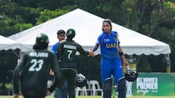 UAE captain Esha Oza shakes hands with Saudi Arabia's Ashmal Hashmi. photo: ACC
