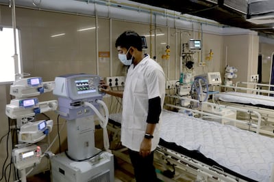 Medical staff perform a drill at a government hospital in Kolkata on Tuesday amid rising Covid-19 cases. EPA