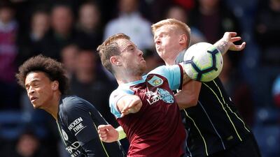 Ashley Barnes tussles with Oleksandr Zinchenko and Leroy Sane. Reuters