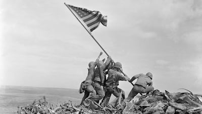 US marines of the Fifth Division, raise the American flag on top of Mount Suribachi on Iwo Jima, Japan, on February 23, 1945. AP