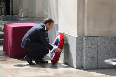French President Emmanuel Macron lays a wreath at foot of the statue of Queen Elizabeth during a ceremony at Carlton Gardens on June 18, 2020 in London, UK. WPA Pool/Getty Images